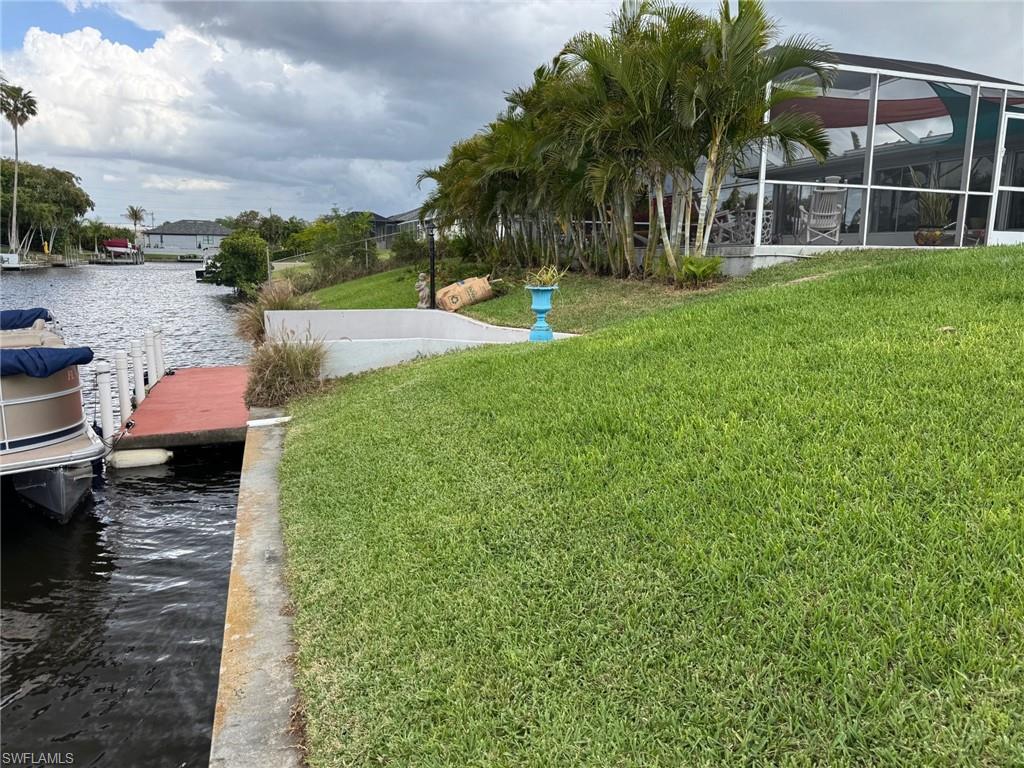 There is a concrete sea wall and concrete dock.