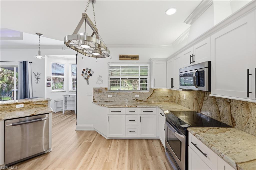 Open-concept layout showcasing arched architectural details and seamless flow between living spaces.