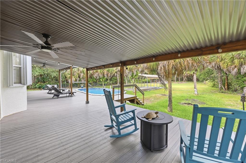 Covered lanai offers a comfortable space to enjoy the outdoor living area and expansive backyard.