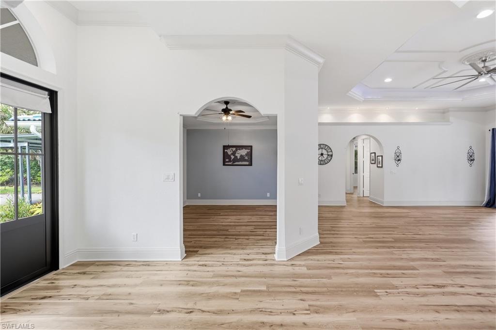 Open-concept layout showcasing arched architectural details and seamless flow between living spaces.