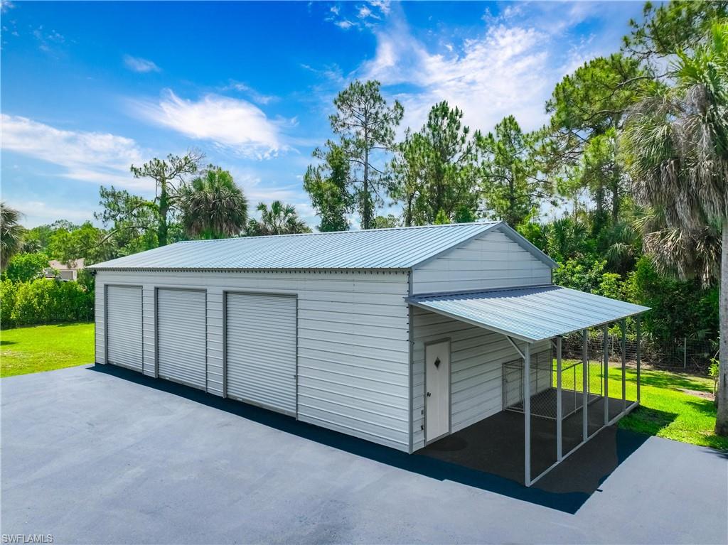 Detached 26-by-50 steel building includes multiple garage bays and flexible space for vehicles, storage, or hobbies.