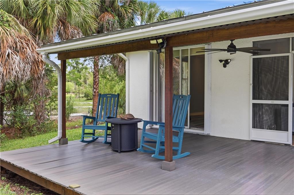 Covered lanai offers a comfortable space to enjoy the outdoor living area and expansive backyard.