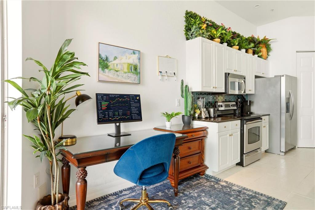 Home office with light tile patterned flooring