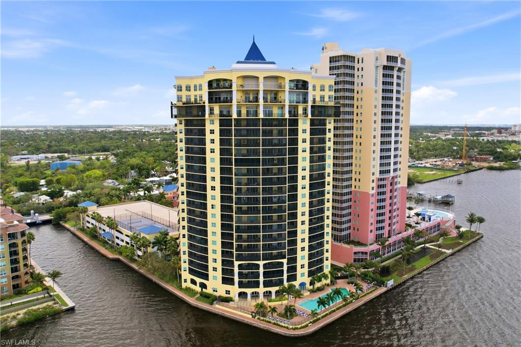 View of building / complex featuring a water view