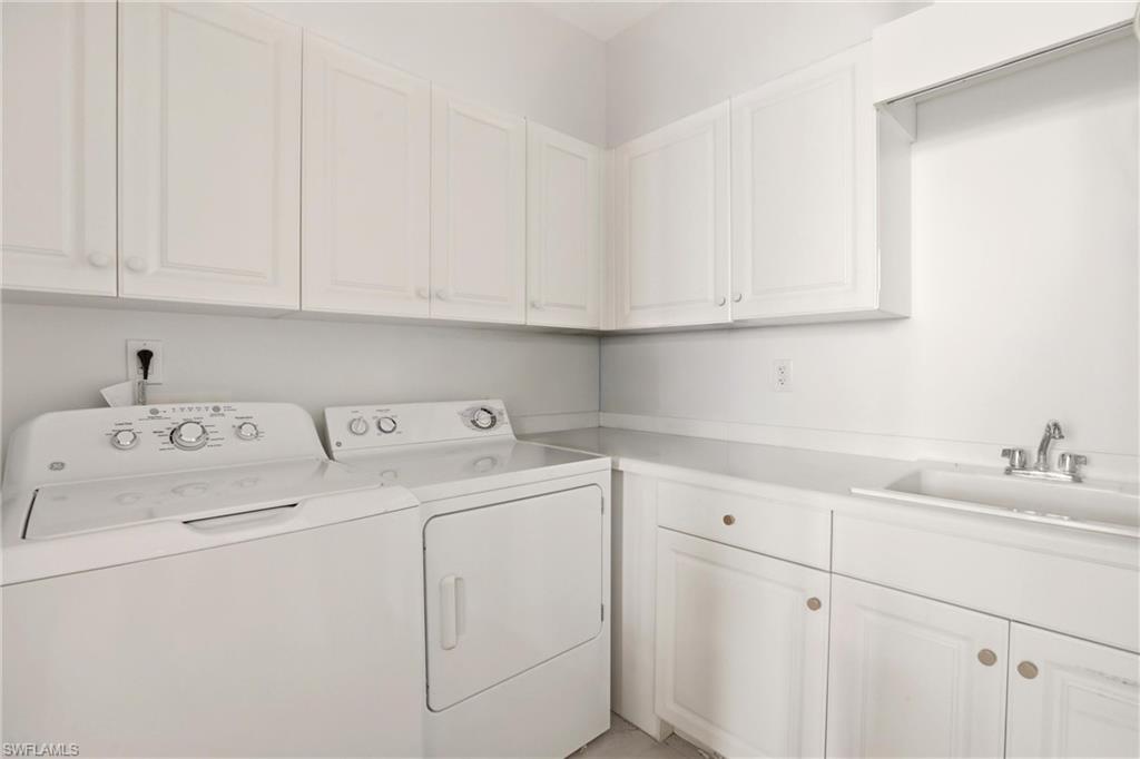 Laundry room with cabinet space and washing machine and dryer