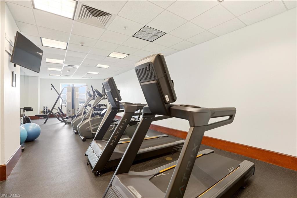 Exercise room featuring a drop ceiling