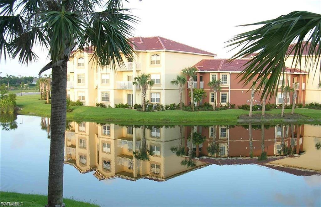 View of apartment building / complex with a water view