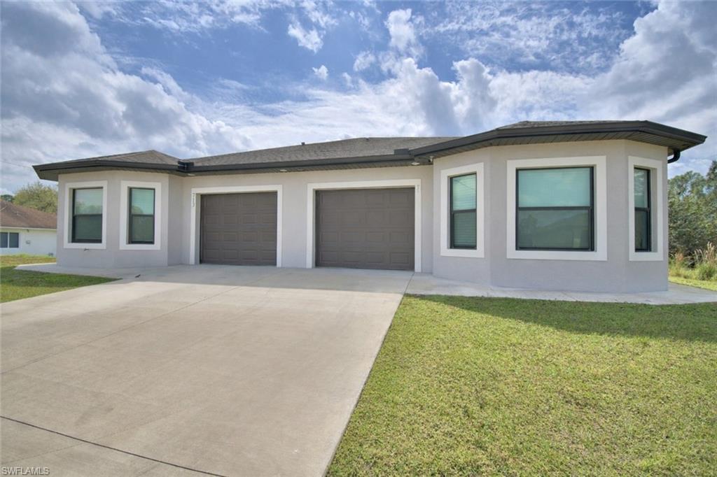 View of front of home with a lawn