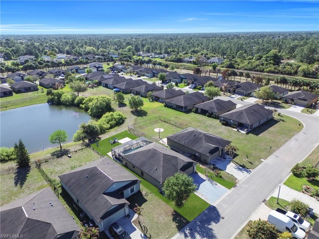 Aerial perspective of suburban area with a large body of water