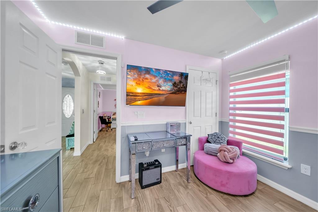 Living area with wood tiled floors