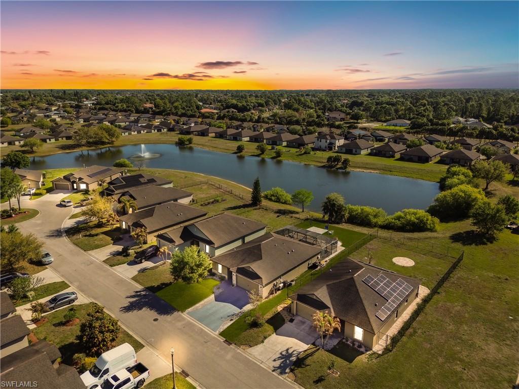Aerial perspective of suburban area with a large body of water