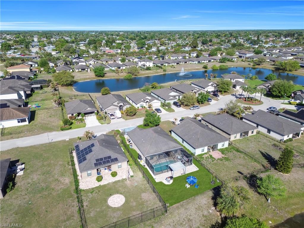 Aerial perspective of suburban area with a large body of water