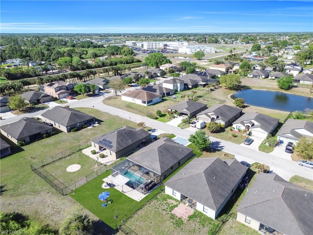 Aerial view of residential area featuring a large body of water