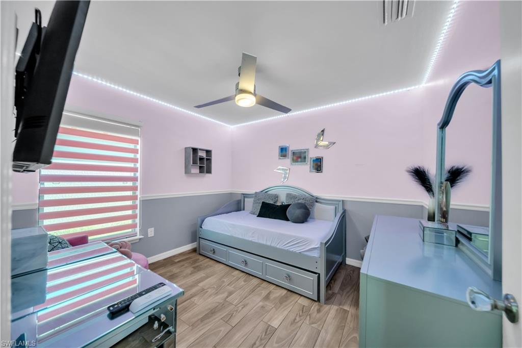 Bedroom featuring light wood-style floors and ceiling fan
