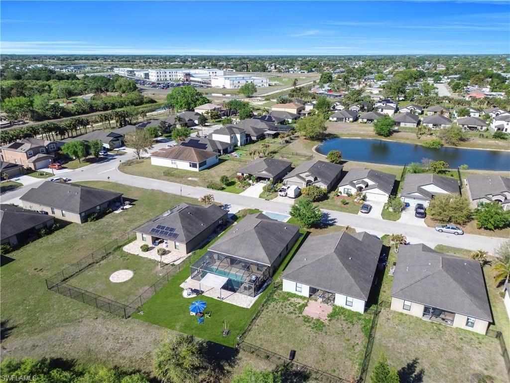 Aerial view of residential area with a nearby body of water
