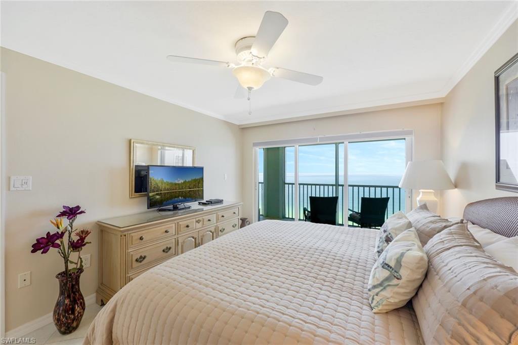 Bedroom with ceiling fan, crown molding, and access to outside