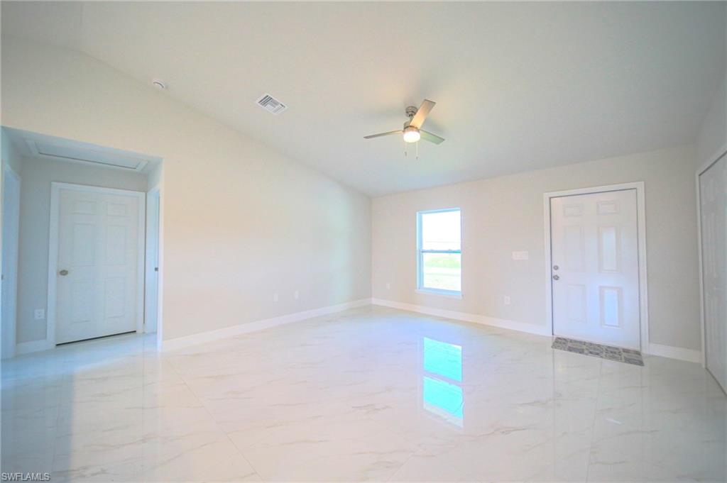 Oversized Titled Living Room With Lighted Ceiling Fan And Vaulted Ceiling!