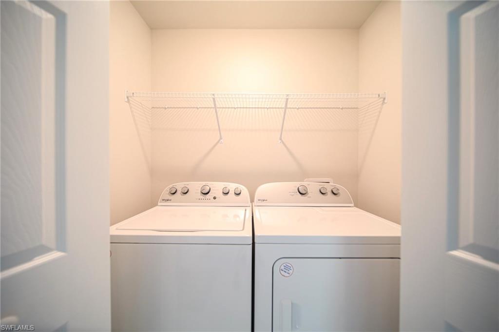 The Laundry Room Has A Brand New Washer And Dryer And Metal Shelving!