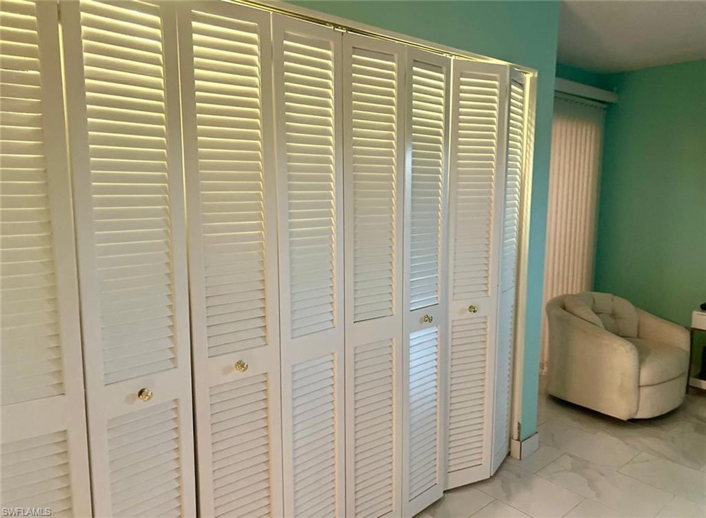 View of interior details with a lot of closets