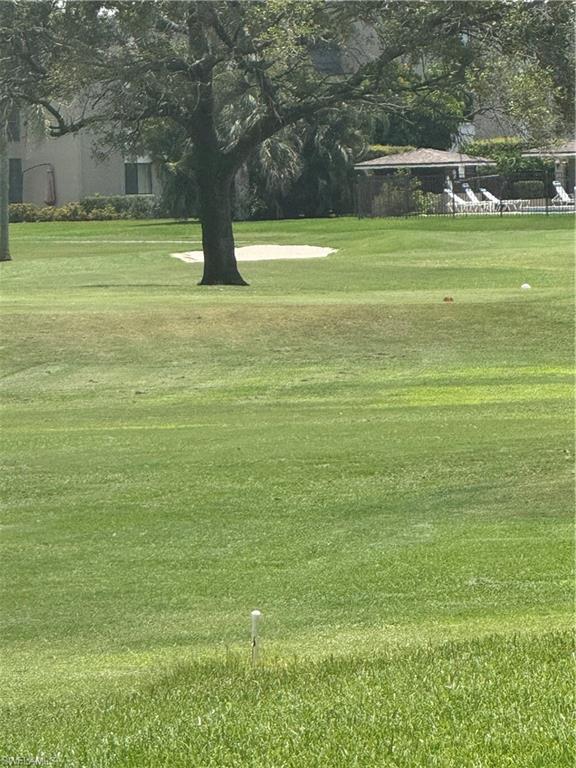 View of the back of the property, featuring a view of the golf course