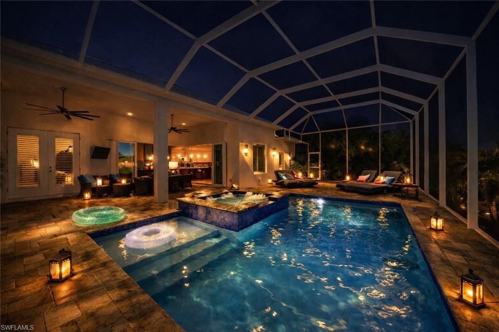 Relaxing pool / spa with a sunroom, a patio area, french doors, and a lanai