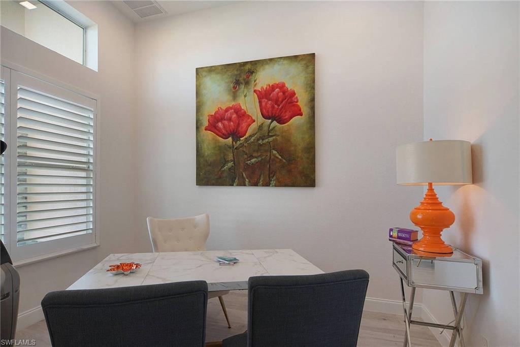 Dining room featuring baseboards and light wood finished floors