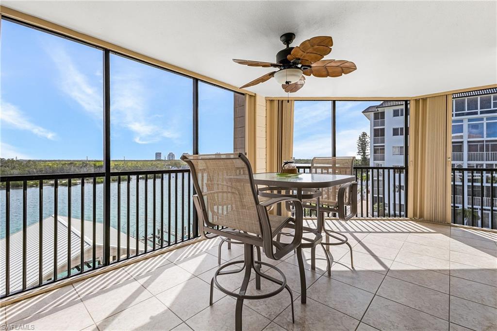 The screened wrap-around lanai faces the bay and has storm shutters for additional protection.