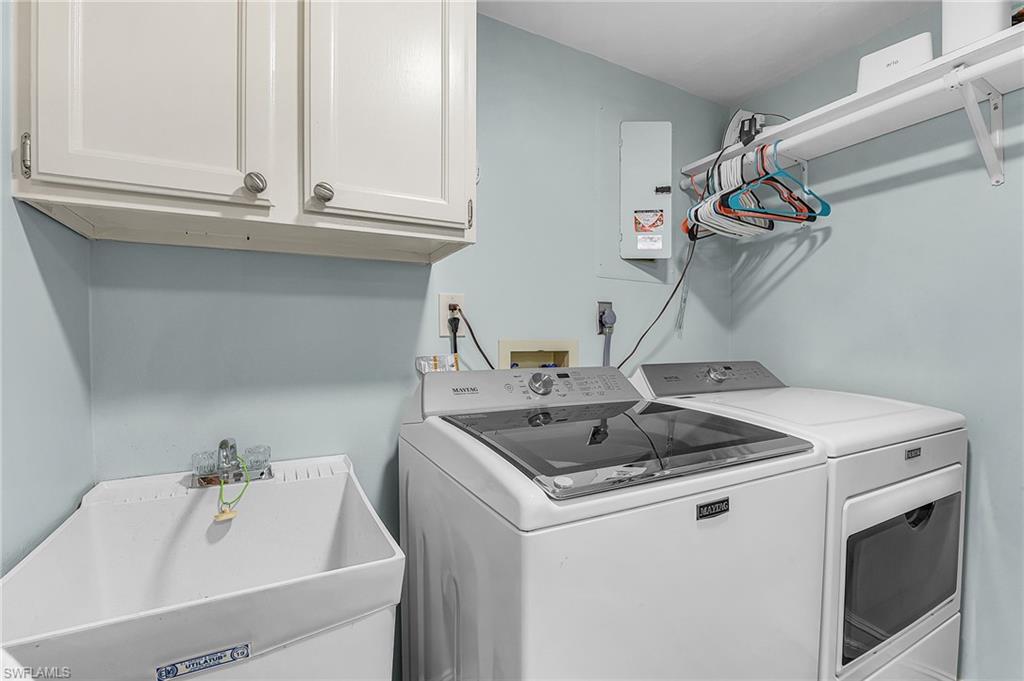 The in-residence laundry room has upgraded washer and dryer, and a utility tub.