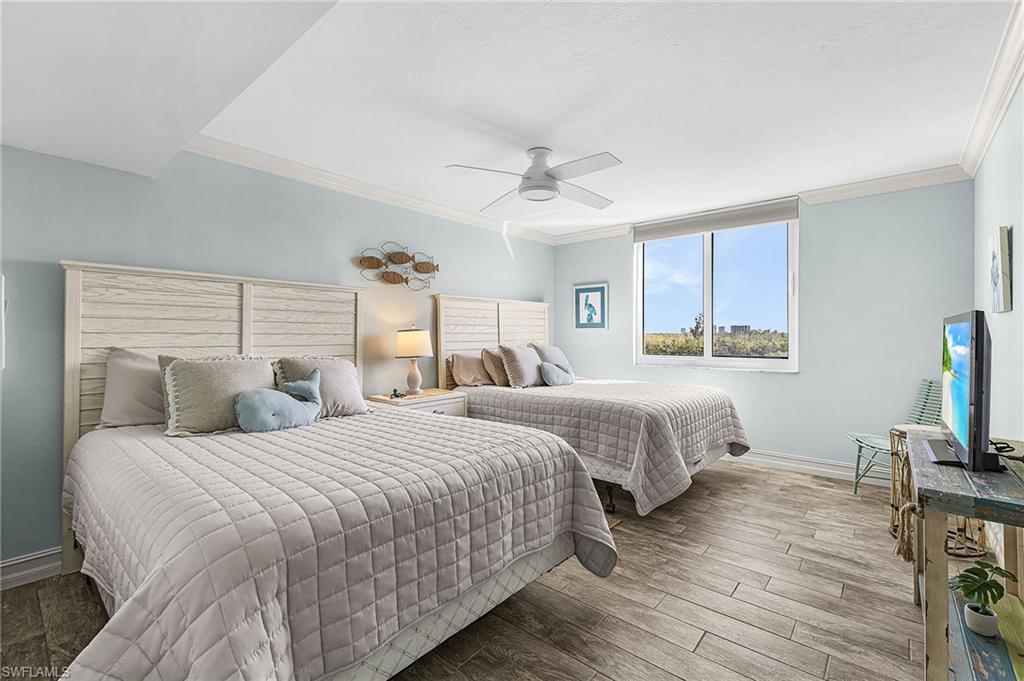 The spacious guest bedroom has two queen beds and a walk-in closet.