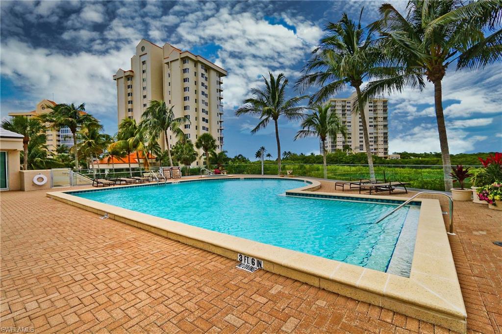 Pool with fence and a patio area
