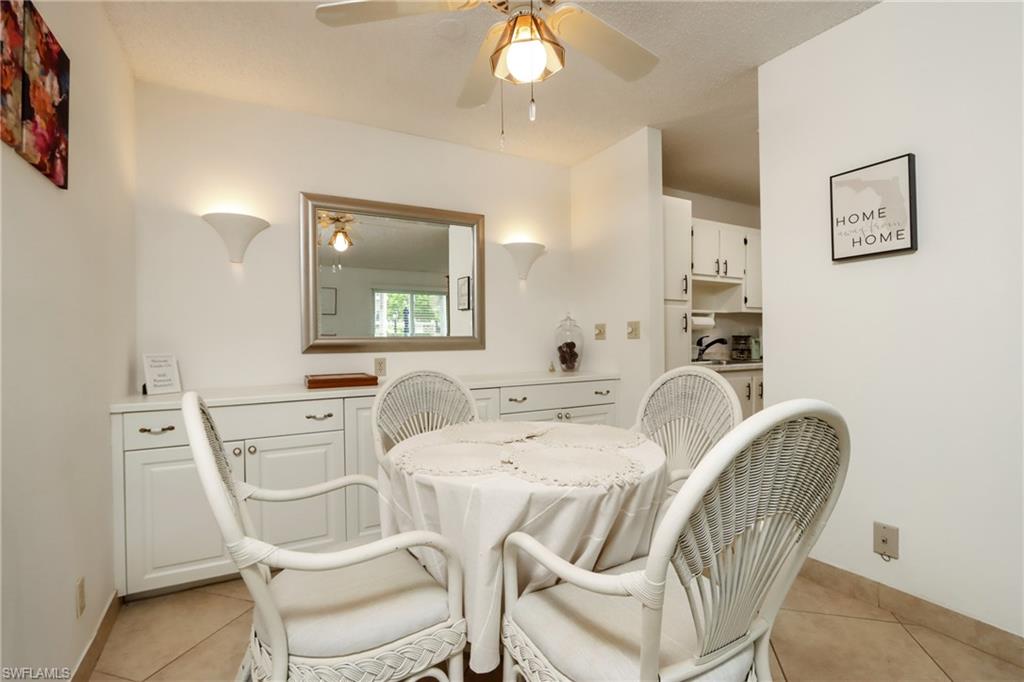 Dining room featuring light tile patterned floors and ceiling fan