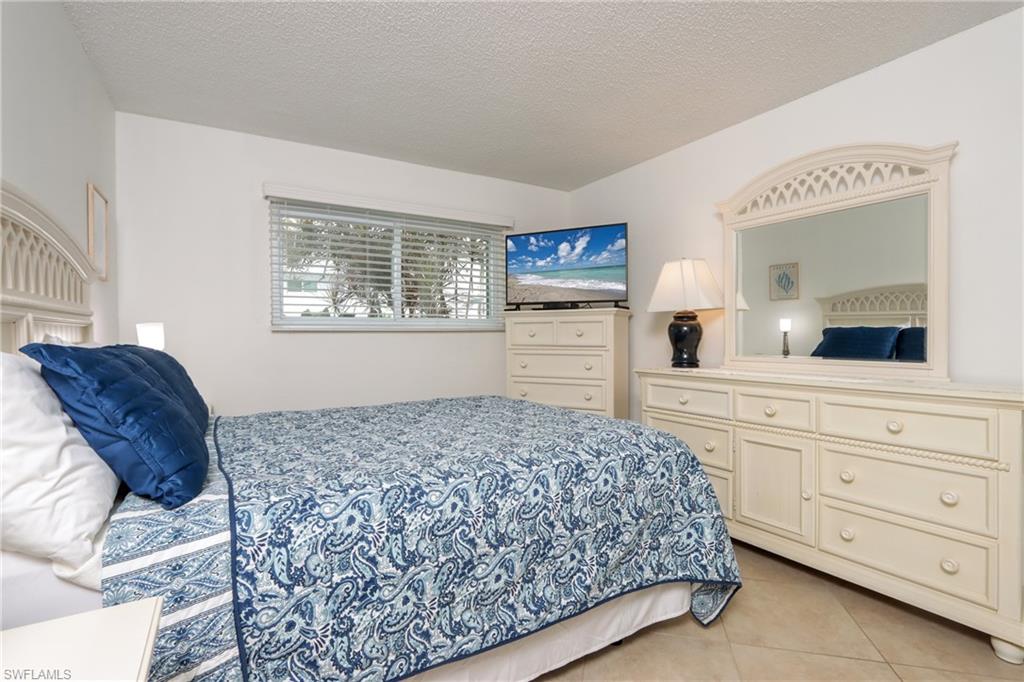 Bedroom with light tile patterned floors