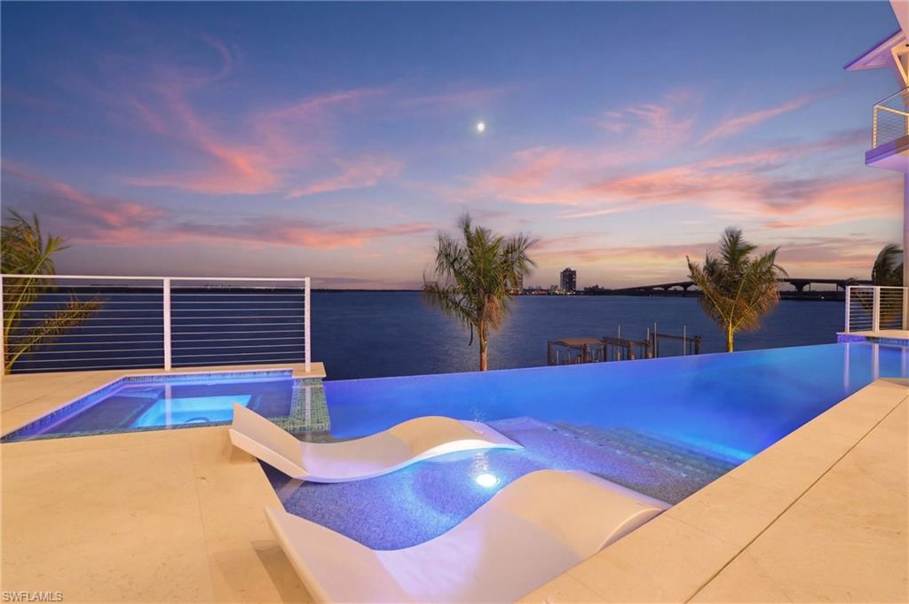 Integrated pool / spa with a patio area and a boat dock - Virtually Edited Image