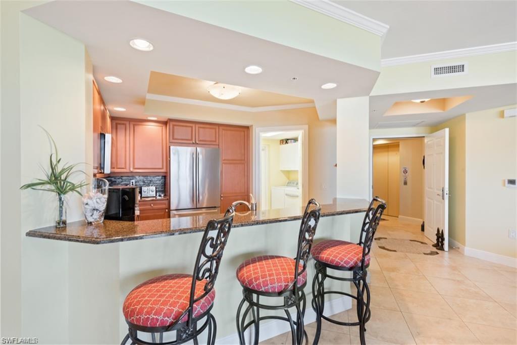 Breakfast bar seating. Private elevator entry in background.