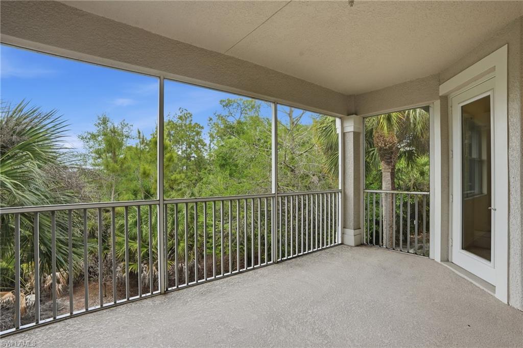 Unfurnished sunroom with a textured ceiling