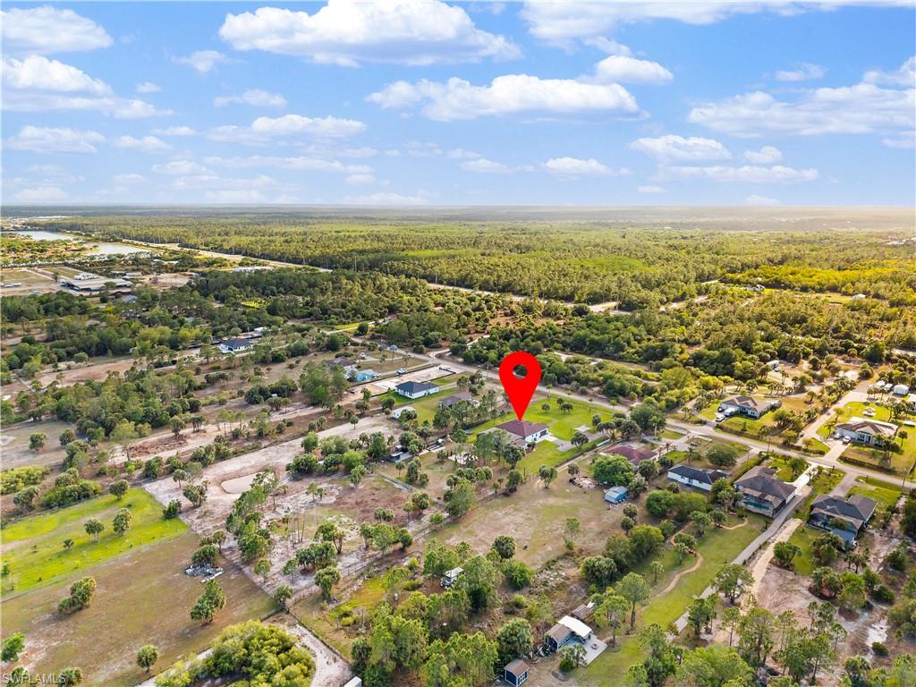 Aerial perspective of suburban area with a heavily wooded area