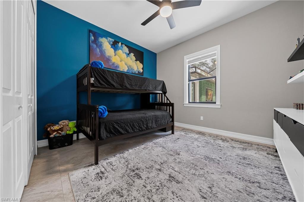 Bedroom with a closet and ceiling fan