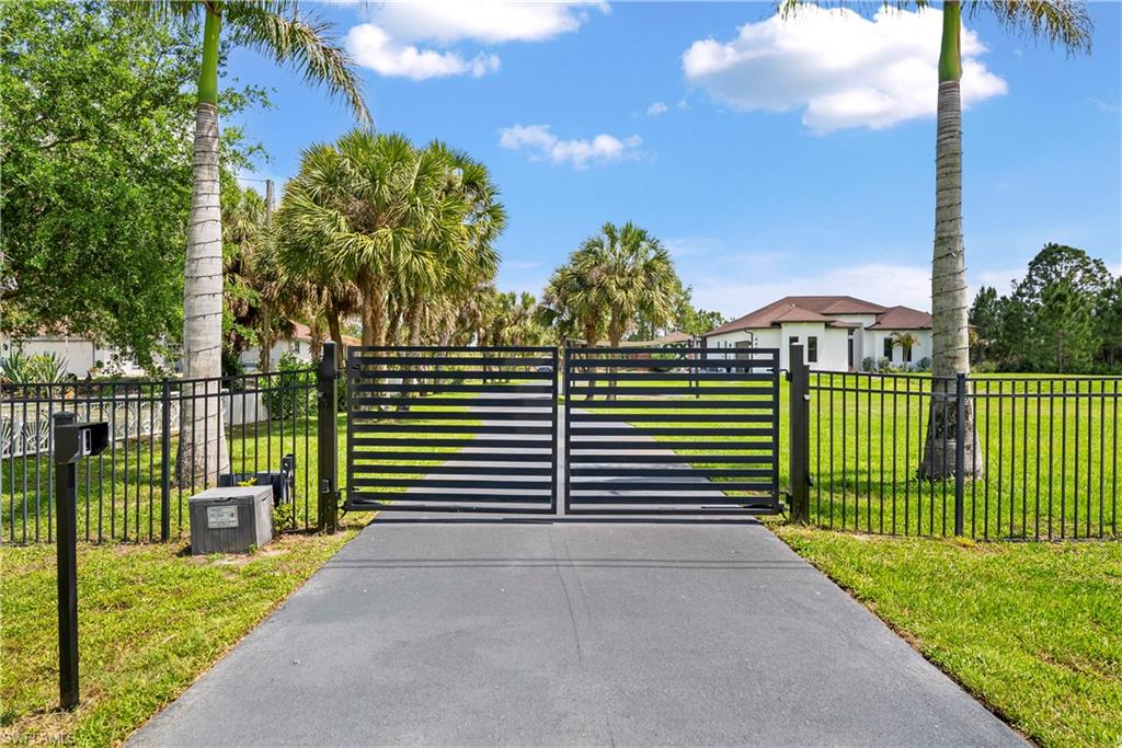 Gate with a fenced front yard