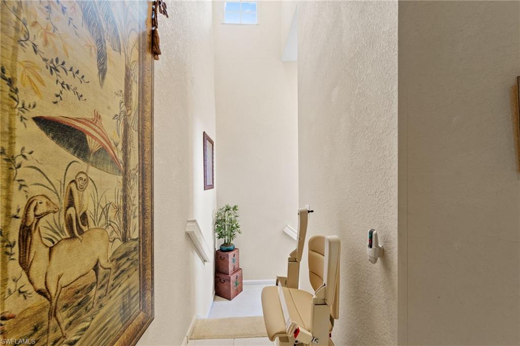 Hallway featuring a textured wall