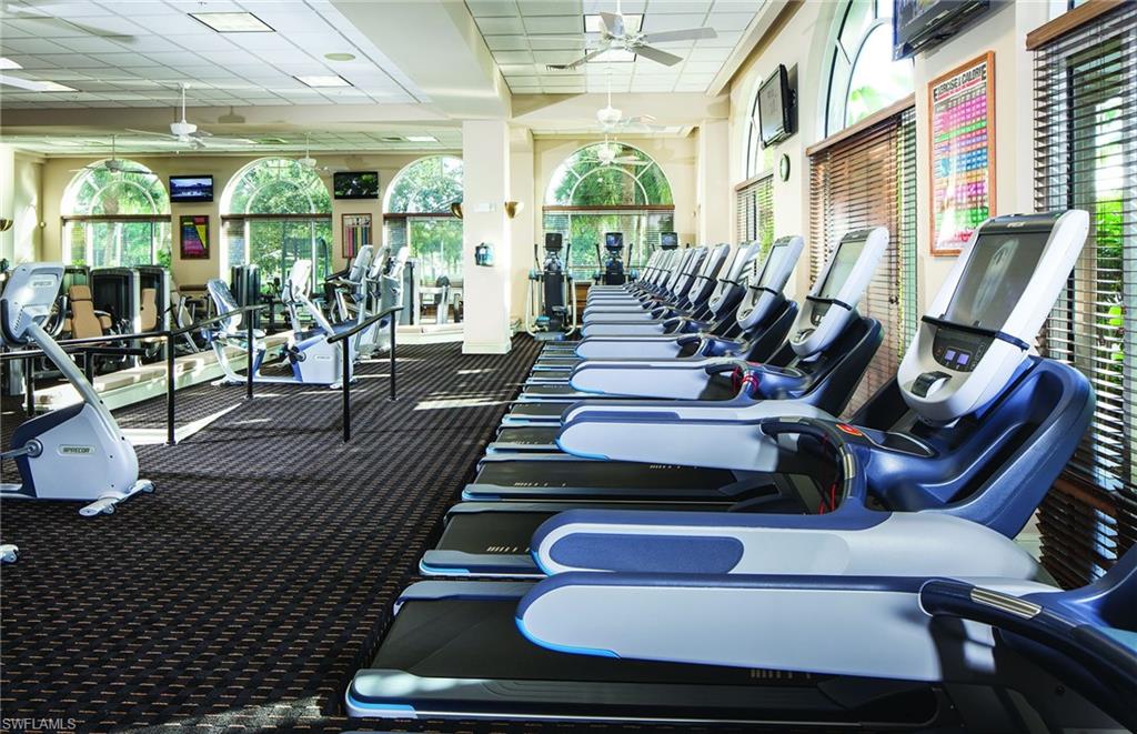 Workout area featuring a drop ceiling and a ceiling fan