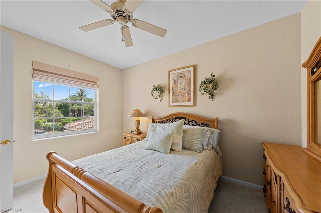 Bedroom featuring ceiling fan and light colored carpet