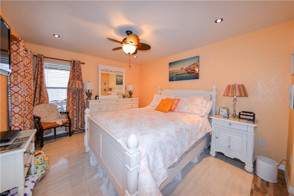 Bedroom featuring recessed lighting, a ceiling fan, and tiled flooring