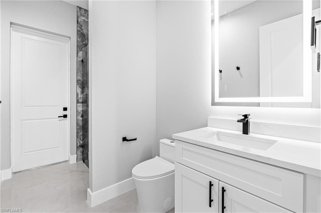 Bathroom featuring vanity and curtained shower