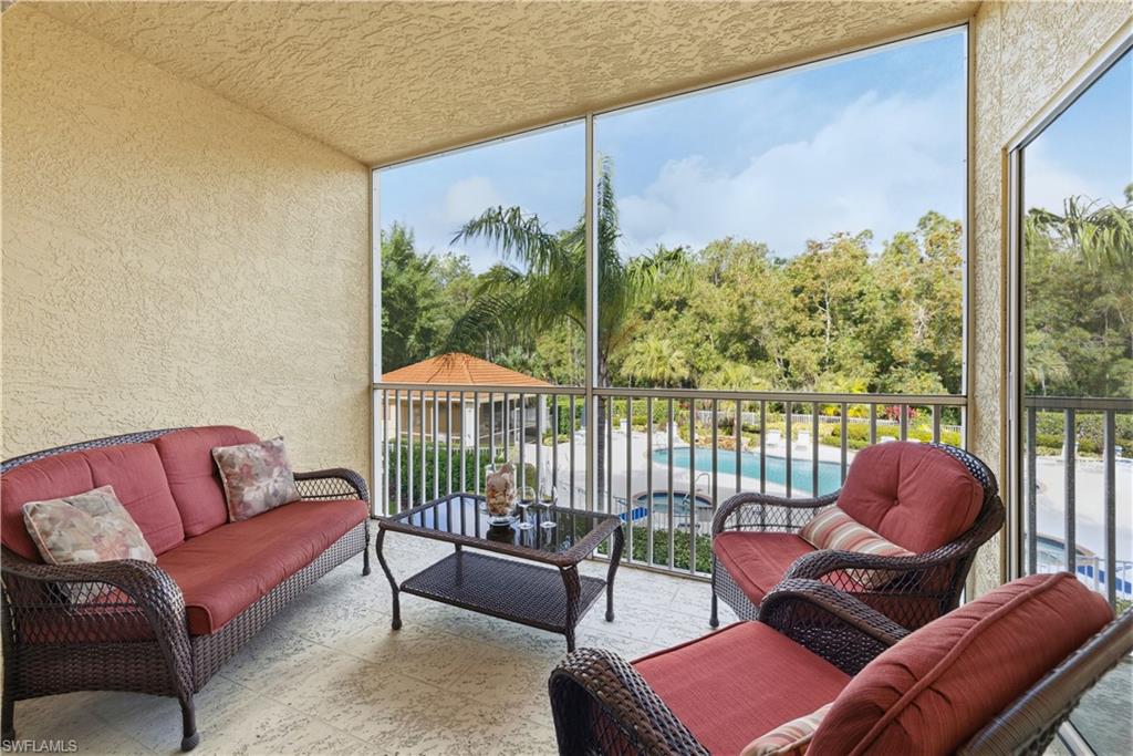 Enjoy views of the pool and preserve from your balcony lanai