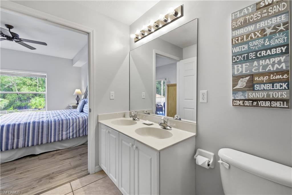 Light and bright bathroom serving primary bedroom