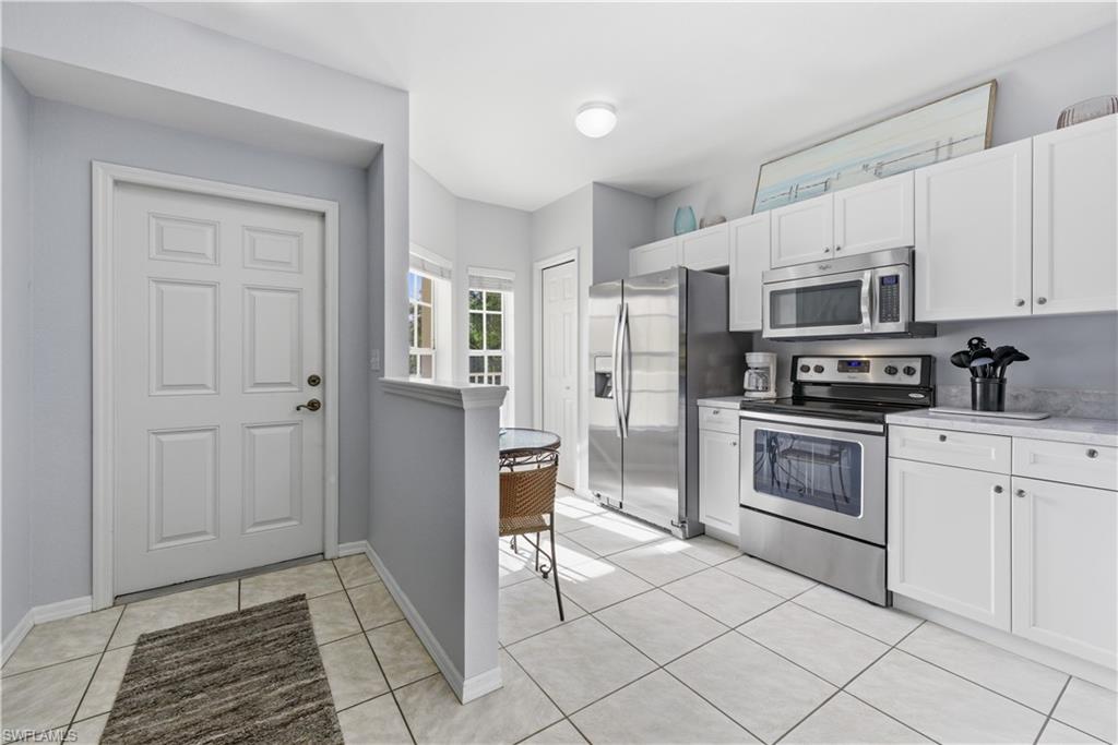 Entry and bright modern coastal kitchen