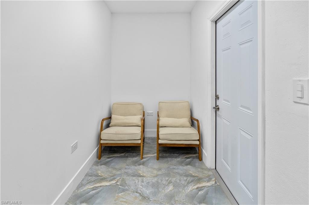 Living area featuring baseboards