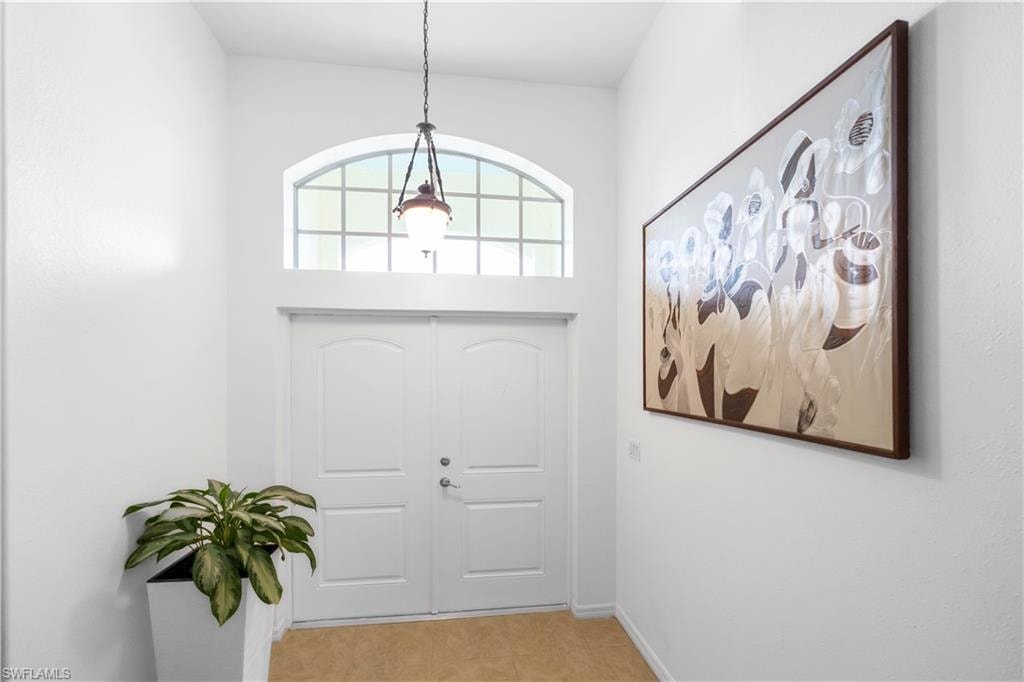 Foyer entrance with baseboards