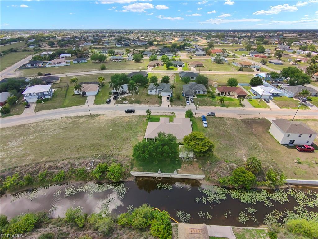Aerial view of residential area with a large body of water