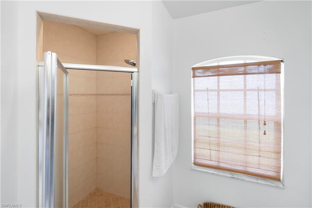 Full bathroom featuring a stall shower